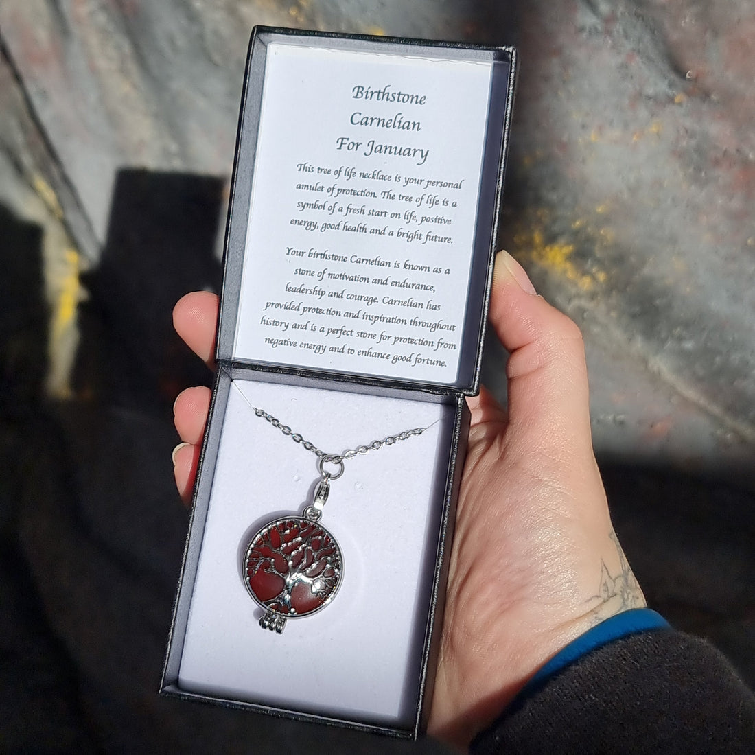 Carnelian Tree of Life birthstone necklace resting in a gift box