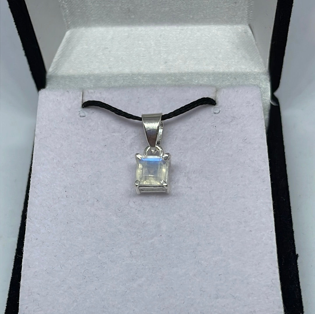 Oval moonstone pendant in an ornate sterling silver setting