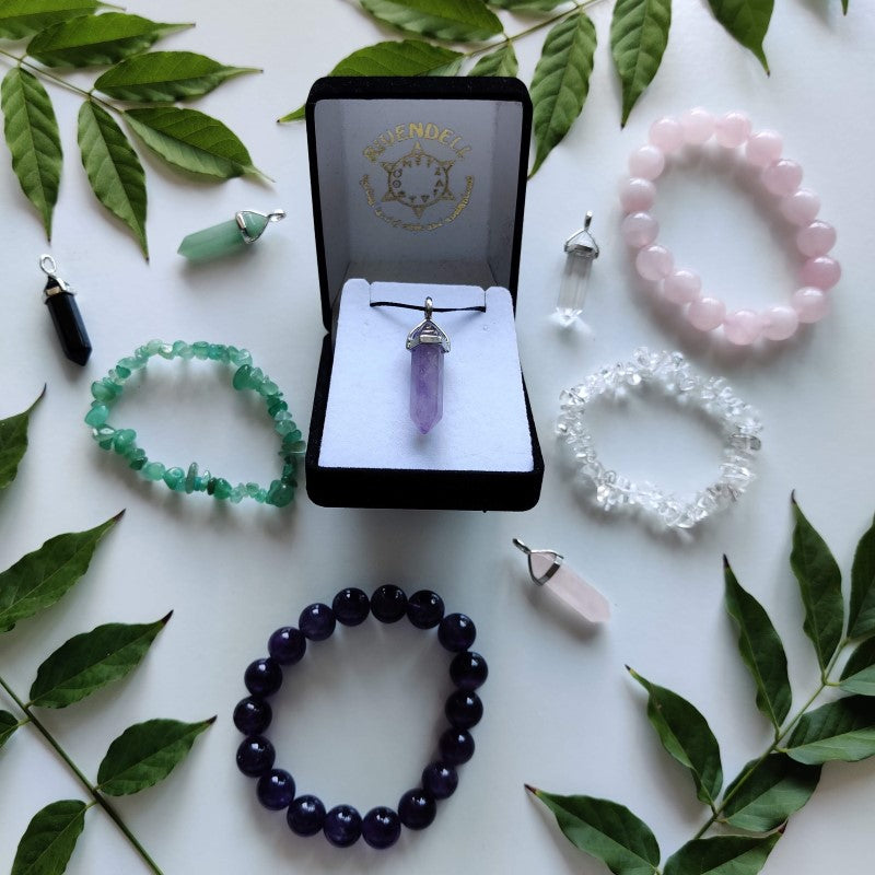 Rivendell crystal jewellery displayed with leaves