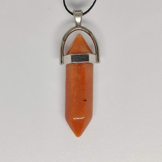 Orange carnelian point pendant with a silver-coloured setting and black cord.