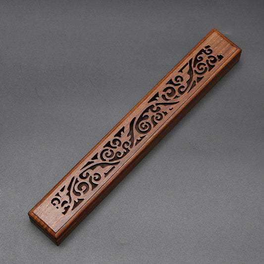 Wooden Koru incense box with a carved lid.