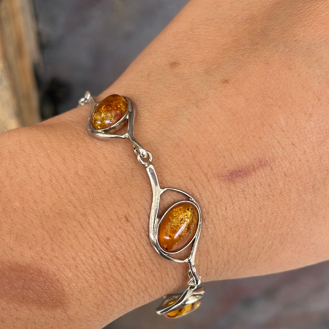 Sterling silver bracelet set with warm honey-coloured amber stones