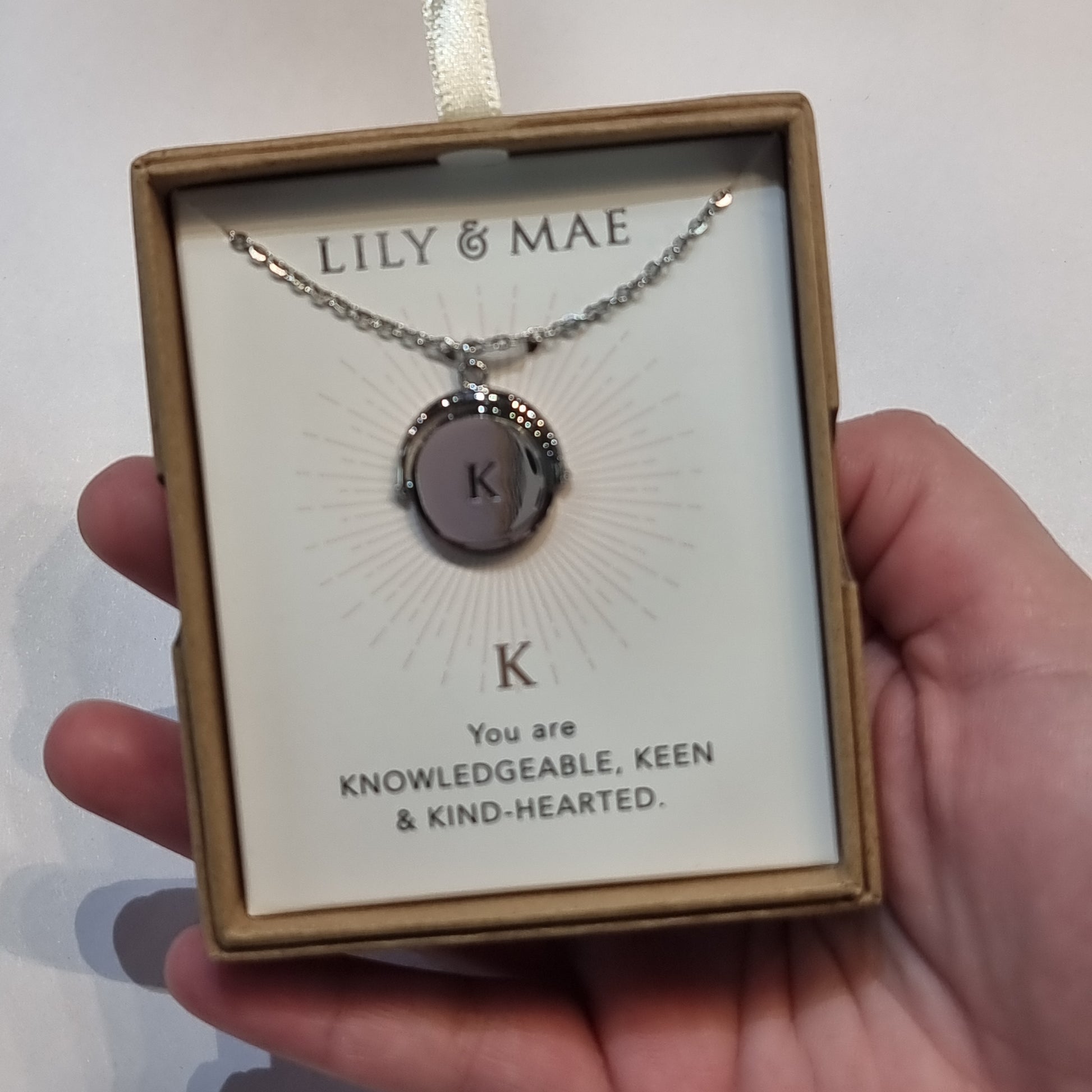 L&M spinning necklace - K - Rivendell Shop