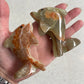 Banded calcite dolphins - Rivendell Shop
